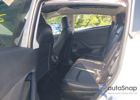 2023 Tesla Model Y Awd/Long Range Dual Motor All-Wheel Drive z USA, uszkodzony, nr VIN 7SAYGAEE5PF971132